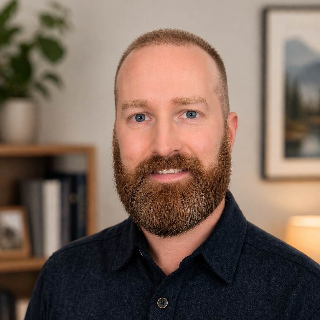 A bearded man in a dark shirt-Lithia Ledger